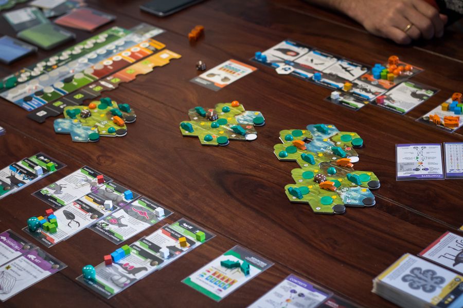 Bios: Megafauna (2nd edition board game) - Mid-game action shot, displaying different playing cards and tokens