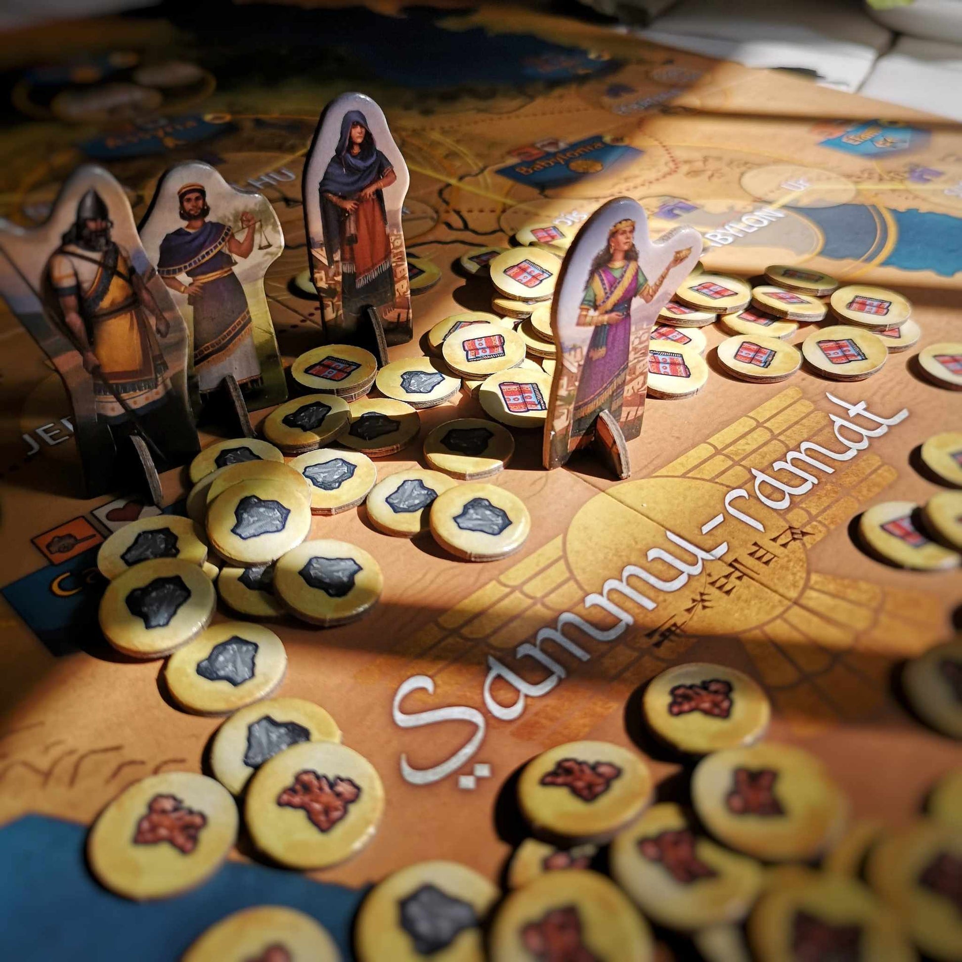 Close up of game components standing on the game board.