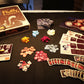 Overview of game, with components, cards and box.