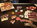 Overview of game, with components, cards and box.