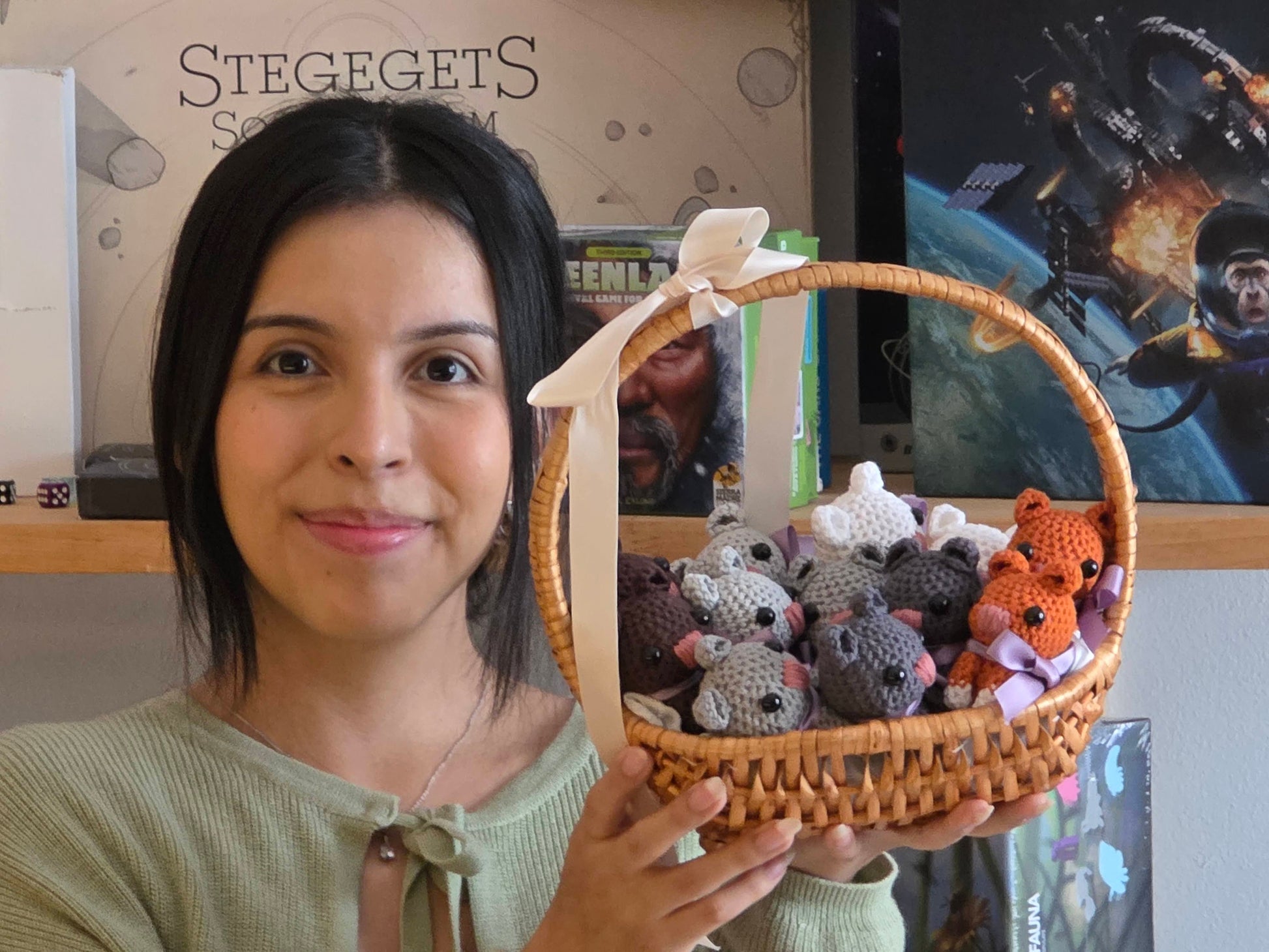 Woman holding a basket with small animal plush toys in front of a store interior.