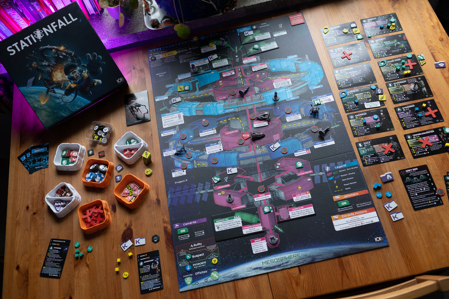 Stationfall overview of the game board with components and box, the game is in play.