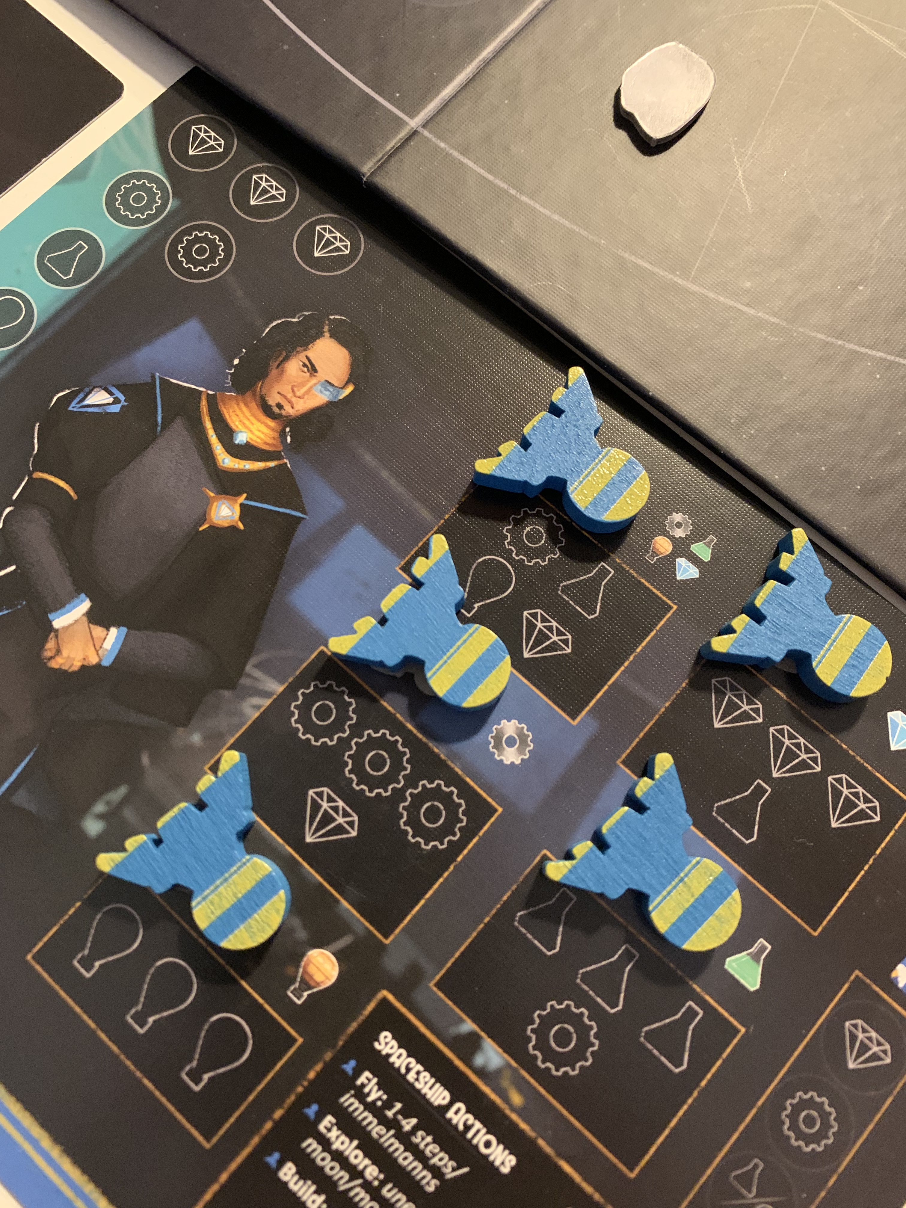 Dawn on Titan Board Game -  blue space ship pieces set up on their player board