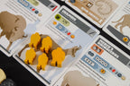 Neanderthal Board Game (2nd edition) - Expanded view of tribesmen pieces laid out on game play cards